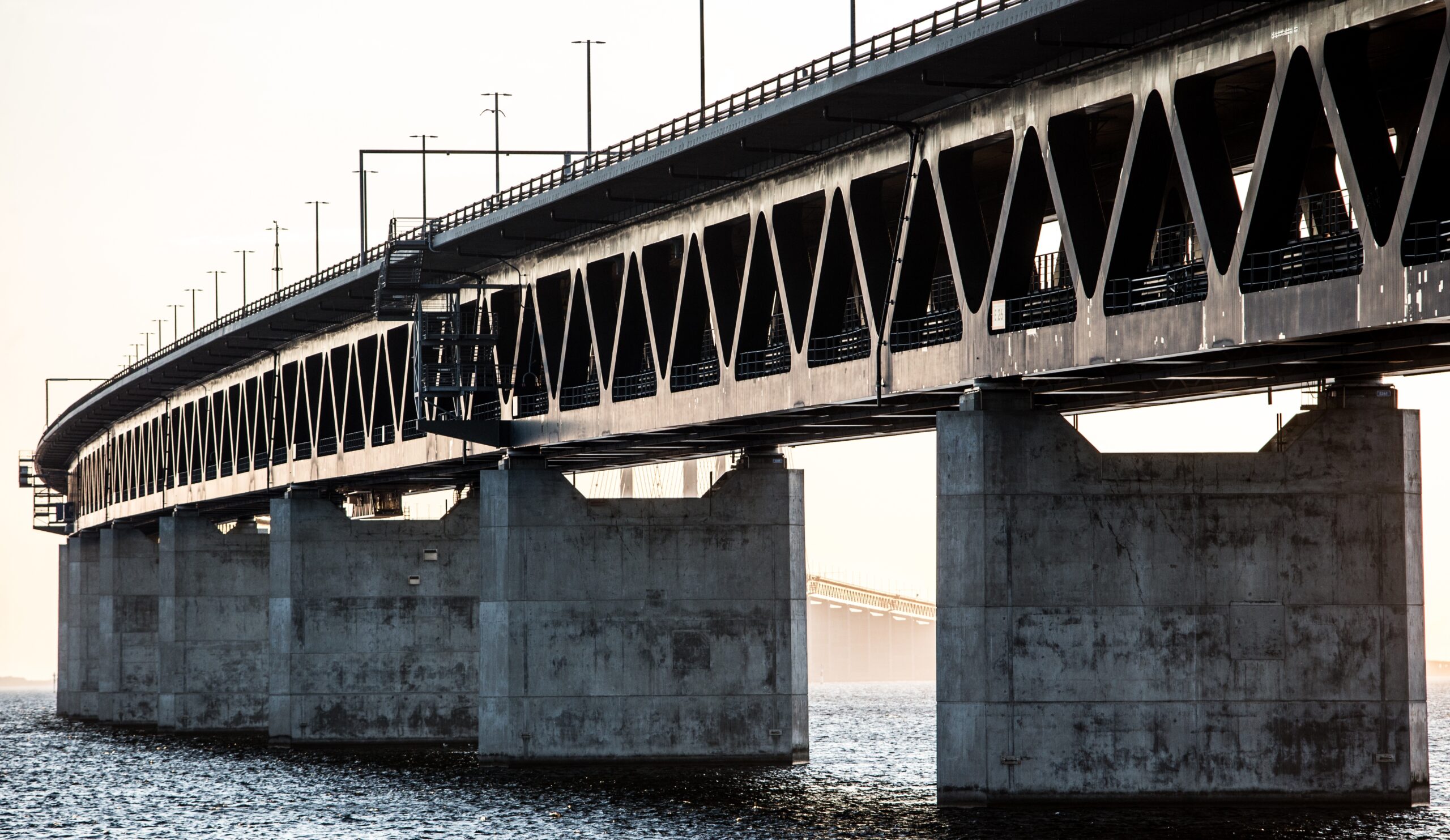 Bridge over the sea with a foggy background